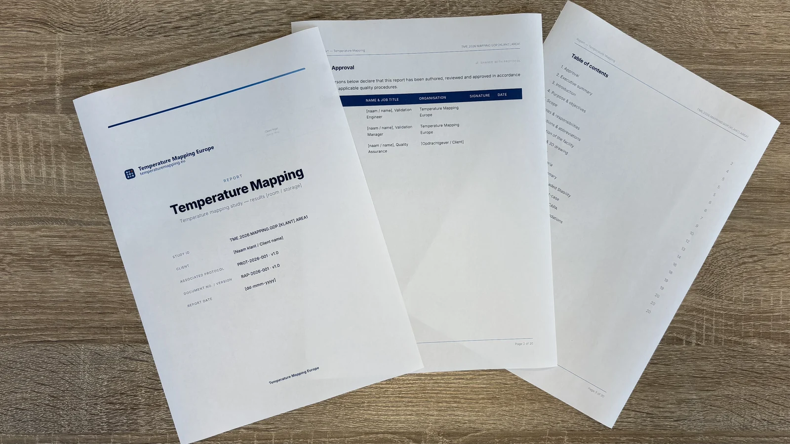 Example of a temperature mapping report: cover page, approval page and table of contents fanned out on a desk.